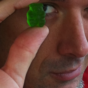 Me holding up a green gummi bear